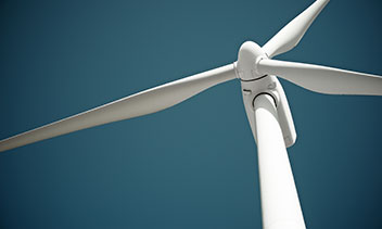 Wind turbine illustrating the maritime green transition, renewable energy, Power-to-X safety, BESS installations and fire risk documentation for new energy systems.